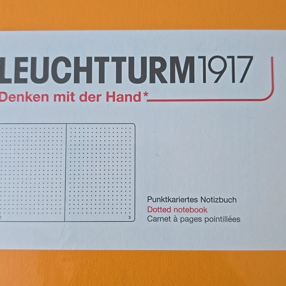 Notebook Medium (A5), Hardcover, 251 numbered pages, Rising Sun, dotted